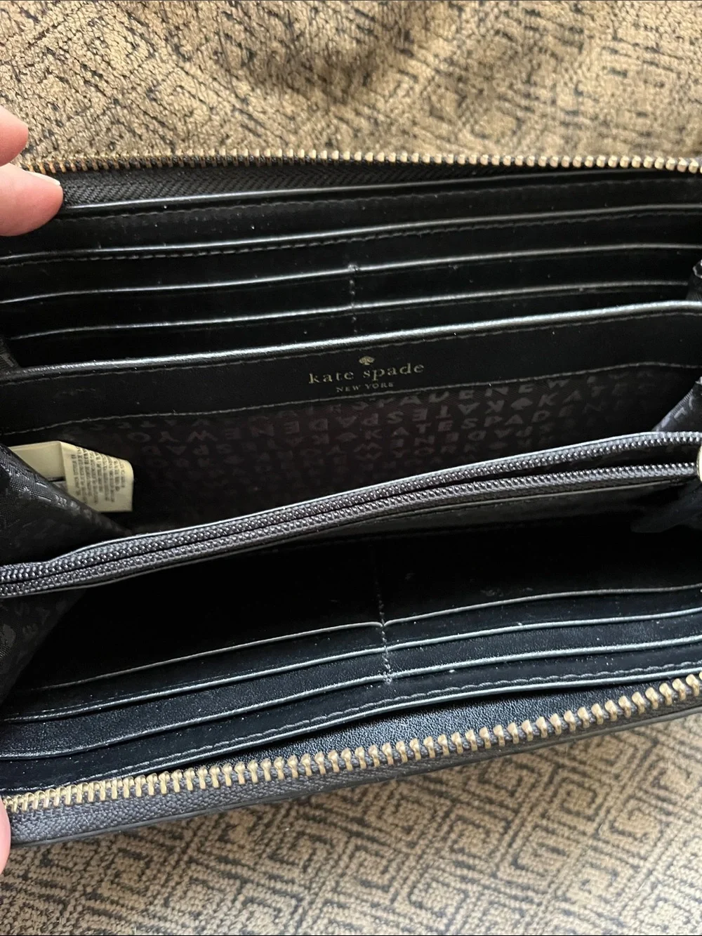 kate spade black quilted spade logo-embossed zip wallet with gold plaque